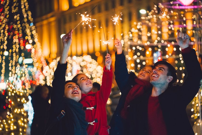 Young family with two kids celebrating New Year