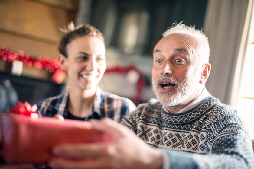 Christmas in mountain house: Family giving presents