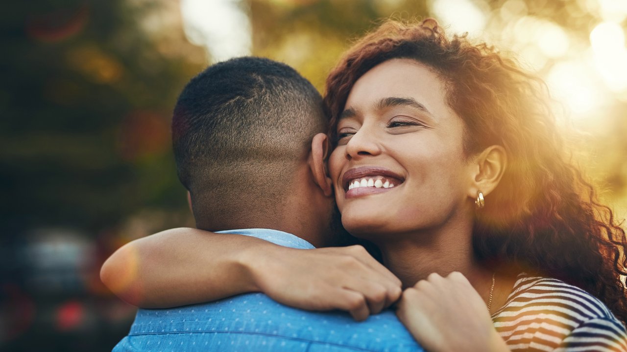 Shot of a happy young couple embracing in the park Shot of a happy young couple embracing in the park