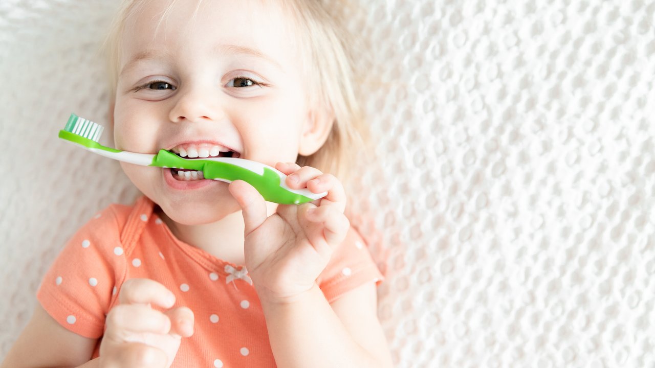 Happy Little Baby with Toothbrush. Dentistry Children's Concept. Copy Space. Smile. Health