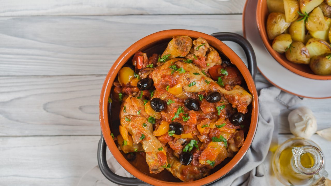 Pollo alla cacciatora- italian hunter-style chicken with onions,  tomatoes,  bell peppers, olives and wine.
