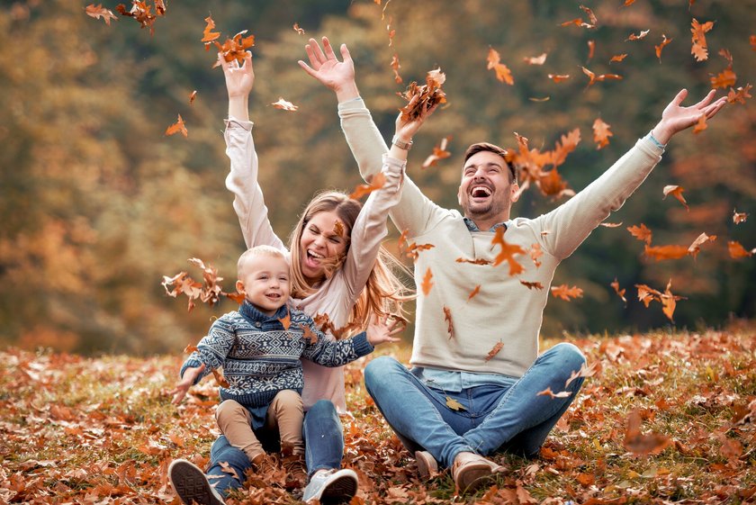 Happy family playing with leaves in beautiful autumn park. Happy family playing with leaves in beautiful autumn park.