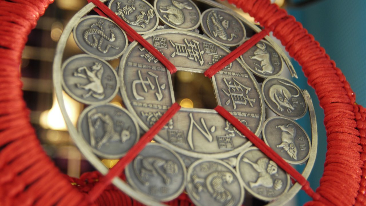 Chinesisches Horoskop: Chinesische Münze mit den Tierkreiszeichen