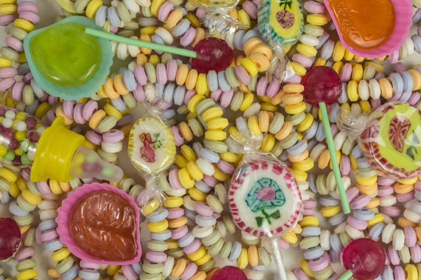 background pastel colored sugar candy necklace and lollies