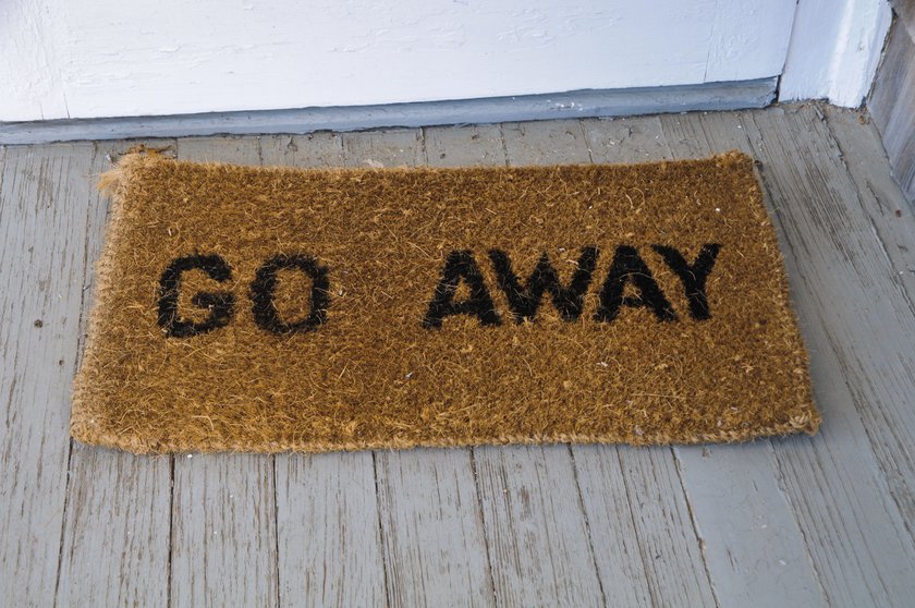 A doormat at a cottage doorway sends an unmistakable message. Often summer visitors on Cape Cod outstay their welcome with family and friends.