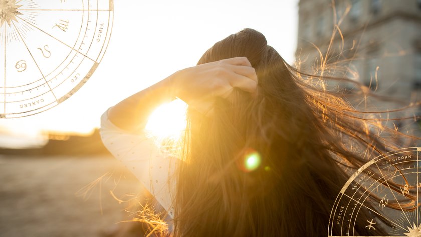 Frau mit wehenden Haaren bei Sonnenaufgang