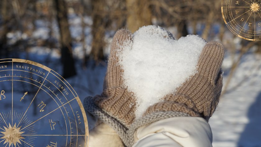 Frau hält ein Herz aus Schnee