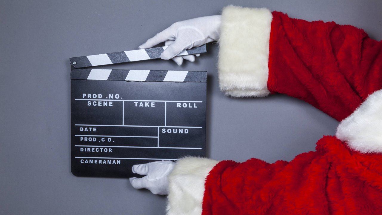 Weihnachtsmann mit Filmklappe