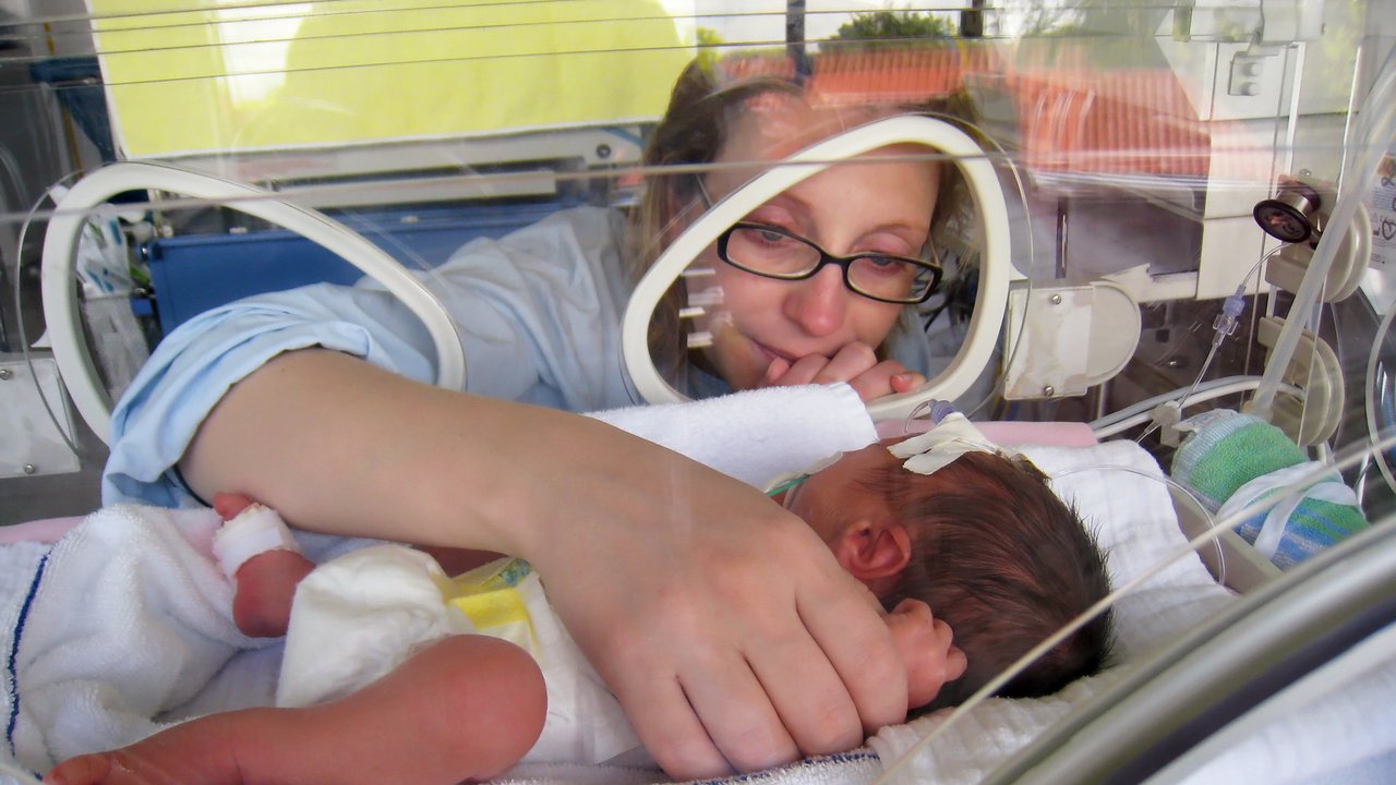 Newborn Premature in Incubator with mother