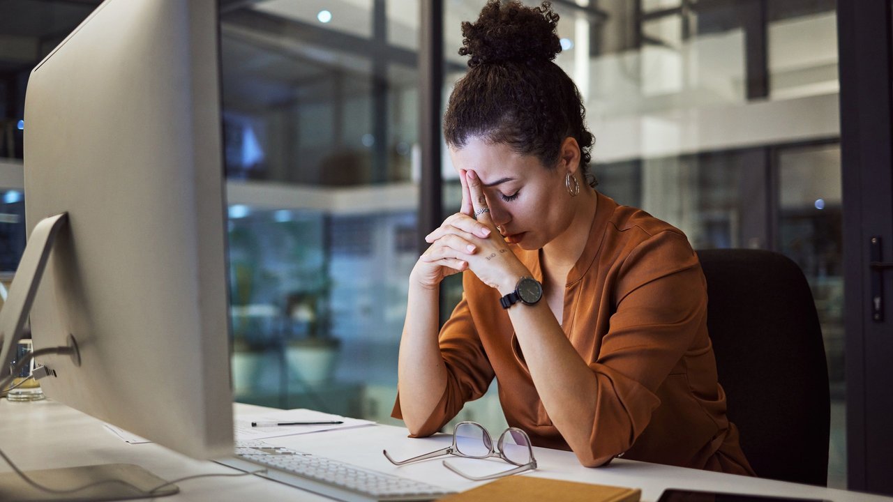 Headache, business woman at night and computer stress while working for a deadline with pc glitch. Sad corporate manager with anxiety about target working at desk screen late to complete task online