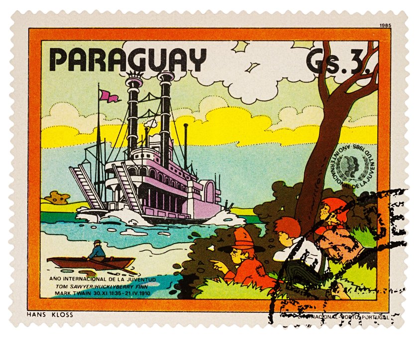 Moscow, Russia - January 18, 2018: stamp printed in Paraguay shows Finn, Friends and Riverboat on Mississippi, Adventures of Tom Sawyer by Mark Twain, series "International Year of Youth", circa 1985