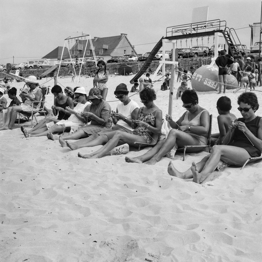 Women participate in a knitting competition on July 29, 1969 on the beach of Trestel, in the Côtes d'Armor in Brittany. (Photo by AFP) (Photo by -/AFP via Getty Images)