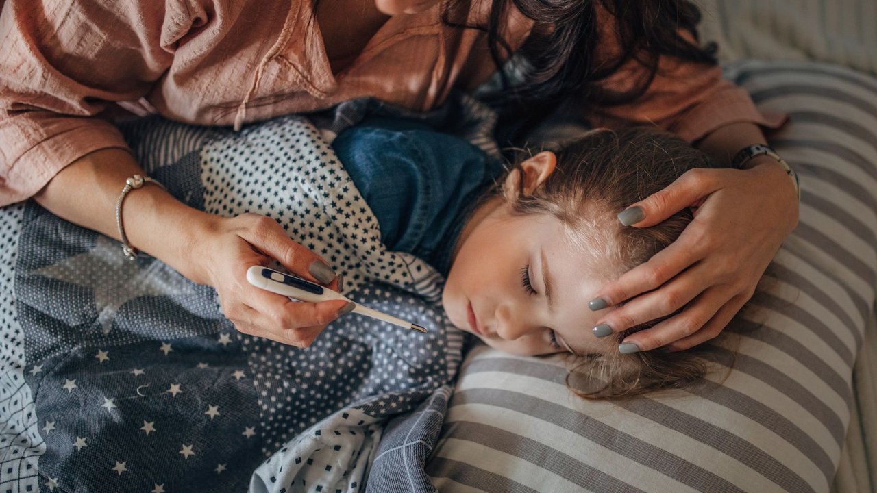 Measure Temperature On Sick Child 