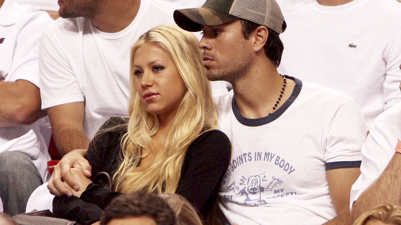 MIAMI - MAY 8:  Former Tennis player Anna Kournikova and singer Enrique Iglesias hold each other as they watch the the New Jersey Nets take on the Miami Heat in game one of the Eastern Conference semifinals at American Airlines Arena on May 8, 2006 in Miami, Florida. The Nets defeated the Heat 100-88. NOTE TO USER: User expressly acknowledges and agrees that, by downloading and/or using this Photograph, user is consenting to the terms and conditions of the Getty Images License Agreement. (Photo by Doug Benc/Getty Images)